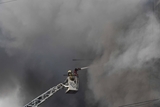 Dozens missing after massive Karachi mall fire, 15 killed